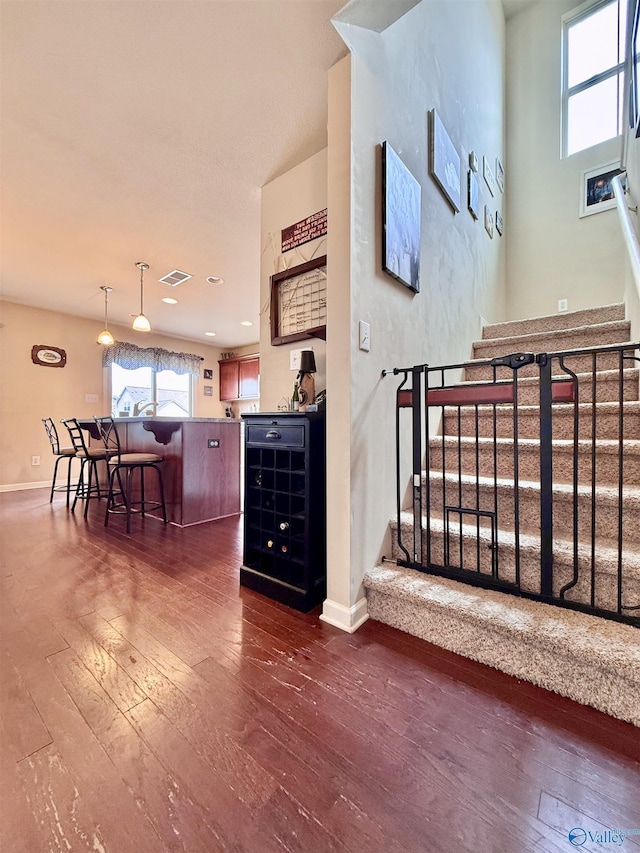 stairway with wood-type flooring