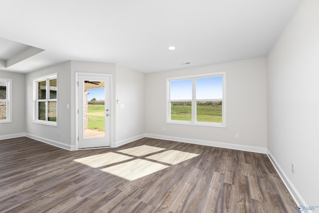 empty room featuring dark wood-type flooring