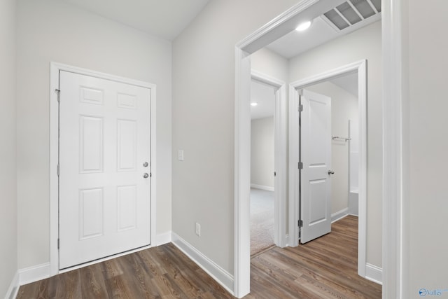 foyer with dark hardwood / wood-style floors