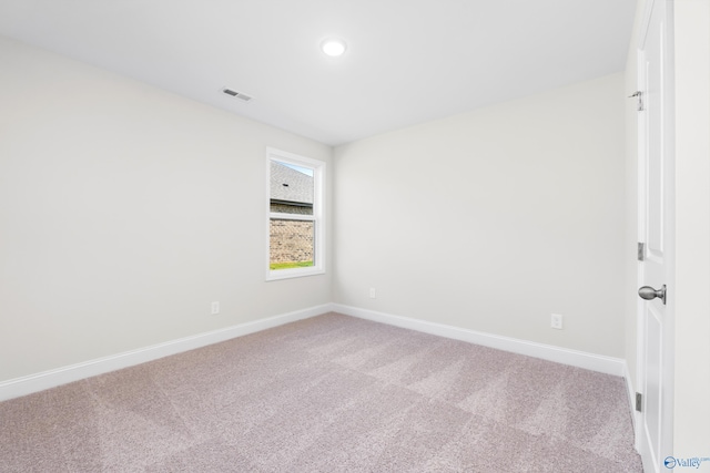 spare room with carpet floors