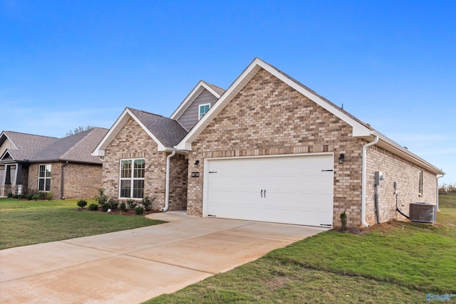 view of front of house with central AC, a garage, and a front yard