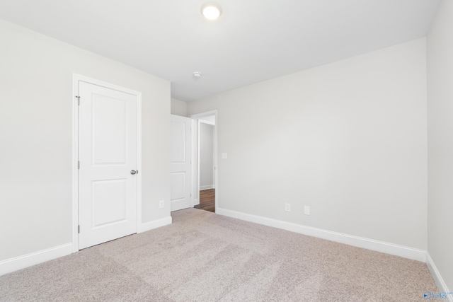 unfurnished bedroom featuring carpet