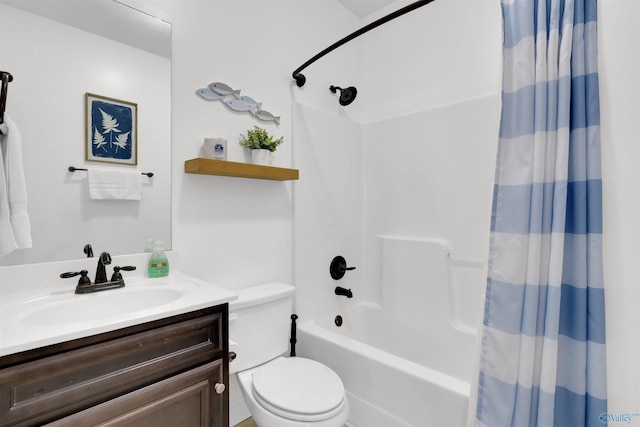 full bathroom featuring shower / bath combo with shower curtain, toilet, and vanity