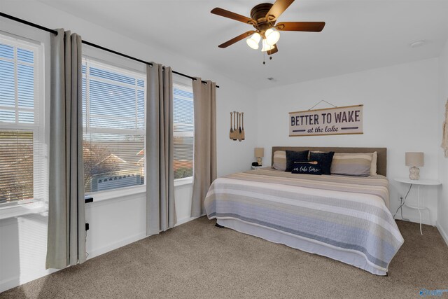 carpeted bedroom with a ceiling fan