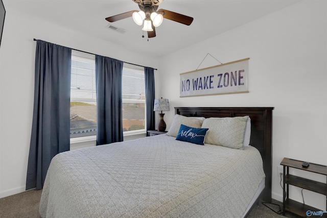 bedroom with visible vents, baseboards, a ceiling fan, and carpet flooring