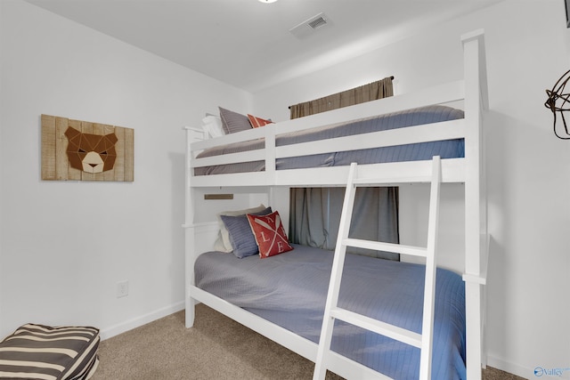 bedroom featuring baseboards, visible vents, and carpet floors