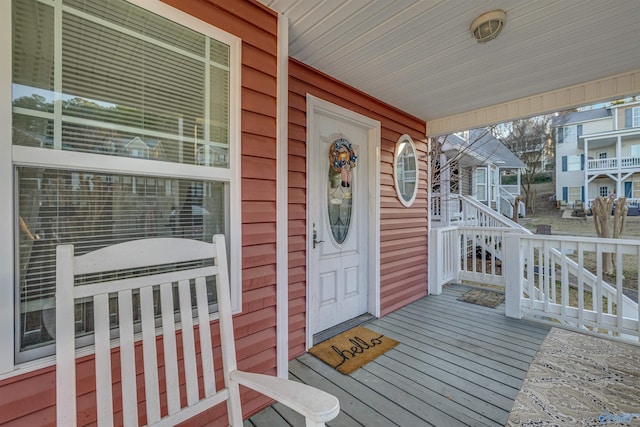 entrance to property featuring covered porch