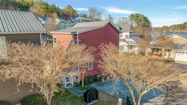 view of property exterior featuring metal roof