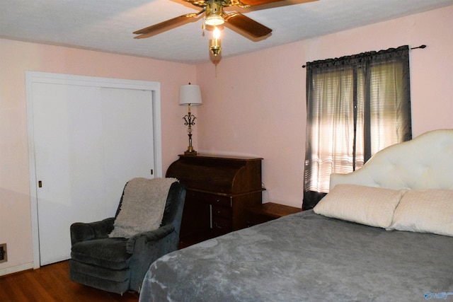 bedroom featuring wood finished floors, a closet, and a ceiling fan