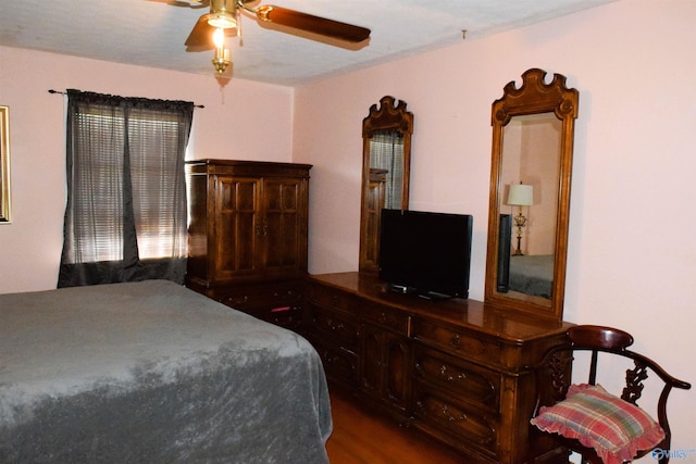 bedroom featuring wood finished floors and ceiling fan
