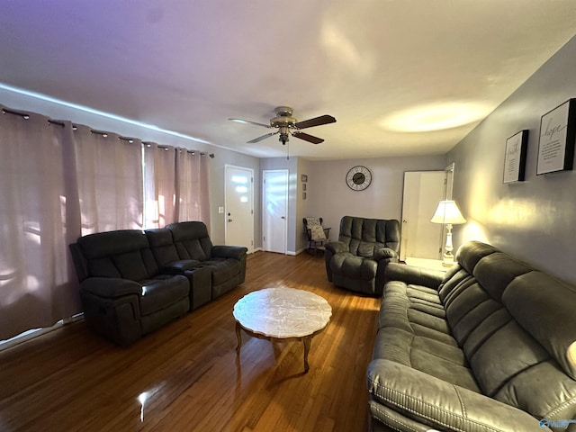 living room with a ceiling fan and wood finished floors