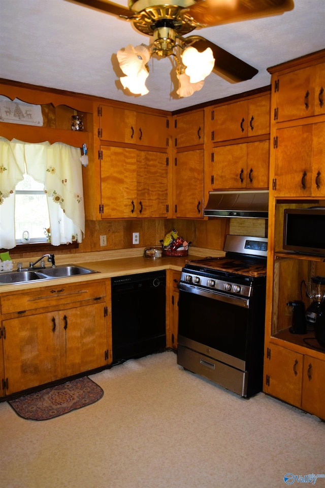 kitchen featuring under cabinet range hood, stainless steel appliances, a sink, brown cabinetry, and ceiling fan