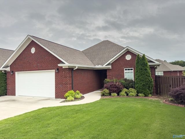 view of front of home with a garage and a front yard