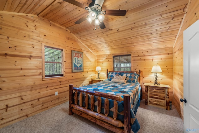 carpeted bedroom featuring vaulted ceiling, ceiling fan, wood walls, and wood ceiling