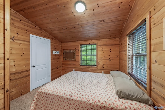 carpeted bedroom with lofted ceiling, wood ceiling, and wooden walls