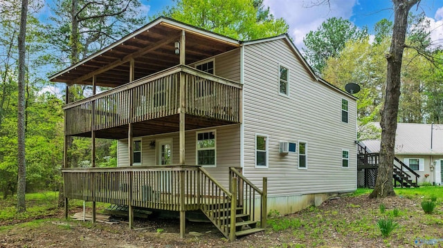 rear view of property with a deck