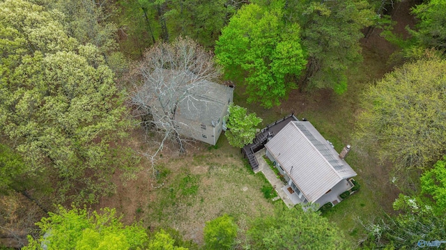 bird's eye view featuring a wooded view