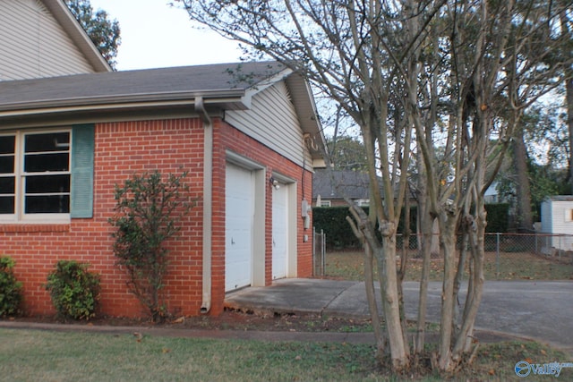 view of side of property with a garage