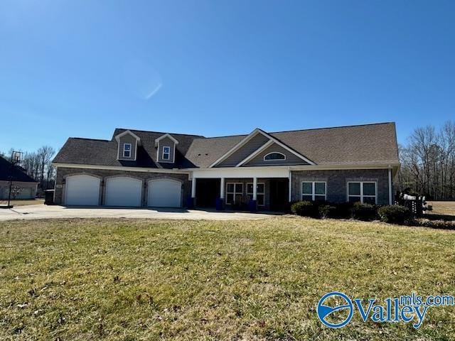 view of front of property featuring a garage and a front yard