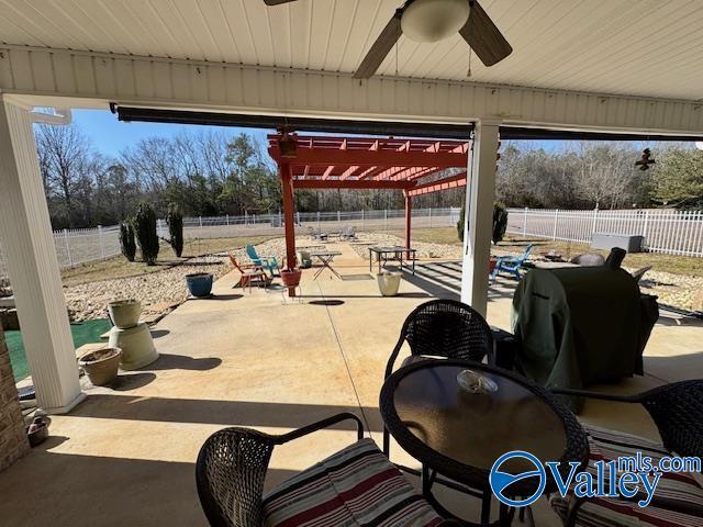 view of patio / terrace featuring ceiling fan