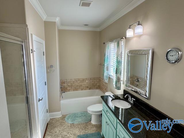 full bathroom with independent shower and bath, vanity, ornamental molding, and toilet