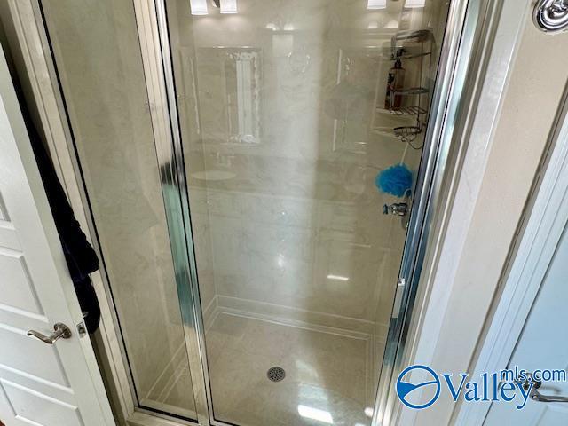 bathroom featuring an enclosed shower