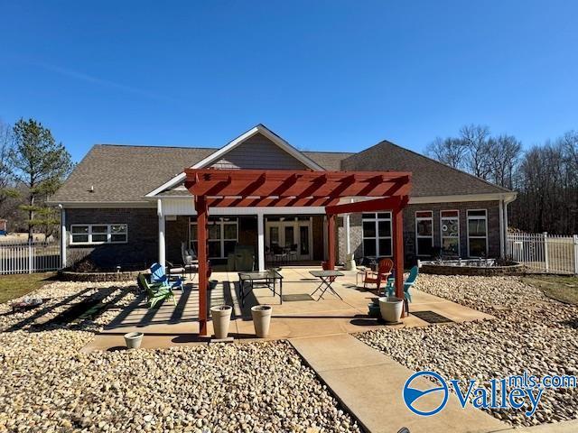 rear view of house with a pergola and a patio area