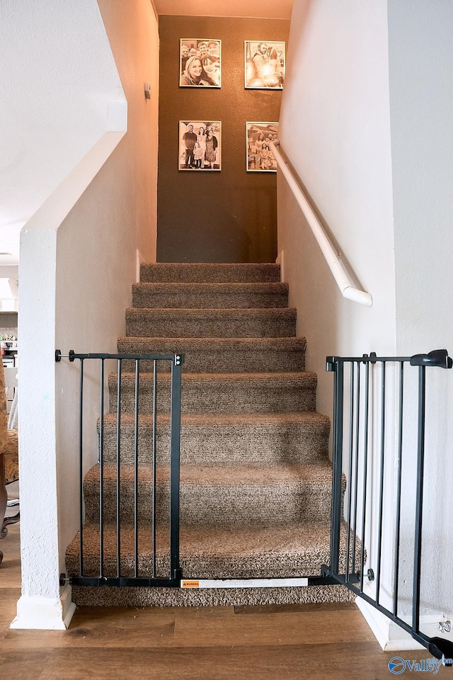 stairs with wood finished floors