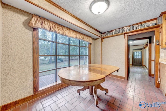 dining area with a textured ceiling