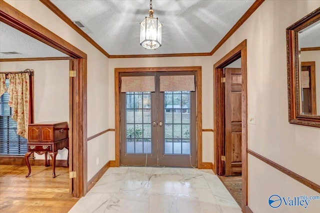 entryway with light wood-type flooring, french doors, crown molding, and a textured ceiling