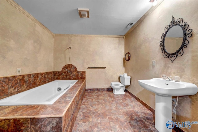 bathroom with tiled bath, toilet, and ornamental molding