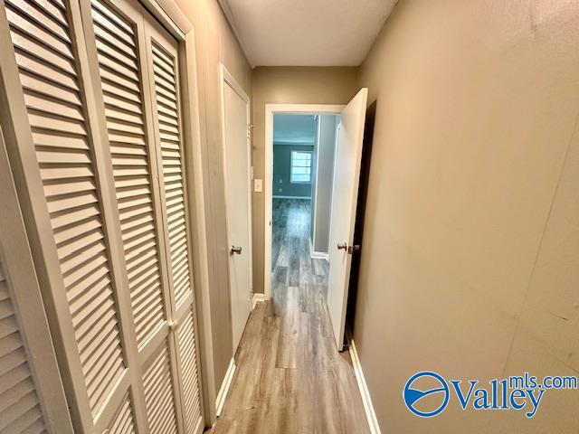 196 Johnson St, Rainsville, AL 35986 - hall featuring light wood-type flooring and baseboards
