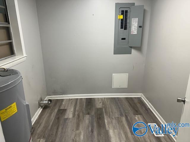 196 Johnson St, Rainsville, AL 35986 - washroom featuring electric panel, wood finished floors, water heater, and baseboards