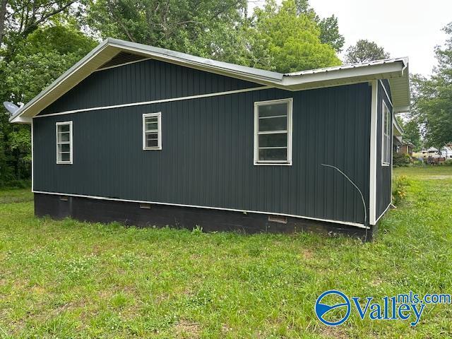 196 Johnson St, Rainsville, AL 35986 - view of home's exterior with crawl space and a lawn