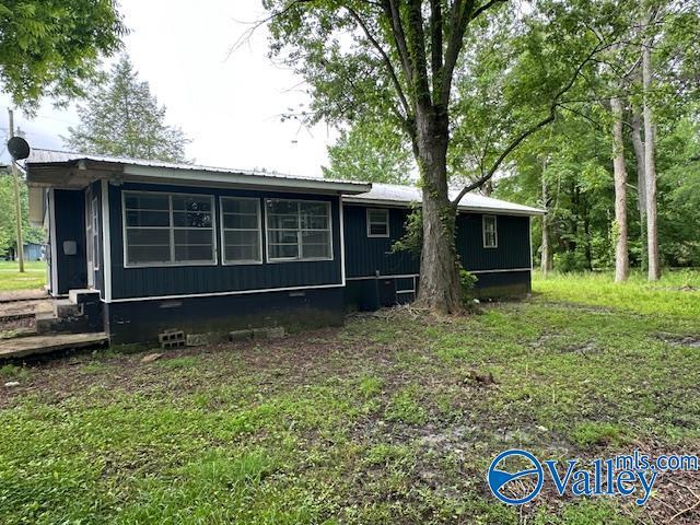 196 Johnson St, Rainsville, AL 35986 - view of side of property with crawl space and metal roof