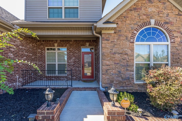 entrance to property featuring a porch