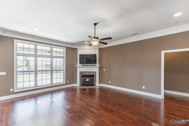 unfurnished living room featuring crown molding, dark hardwood / wood-style floors, and ceiling fan