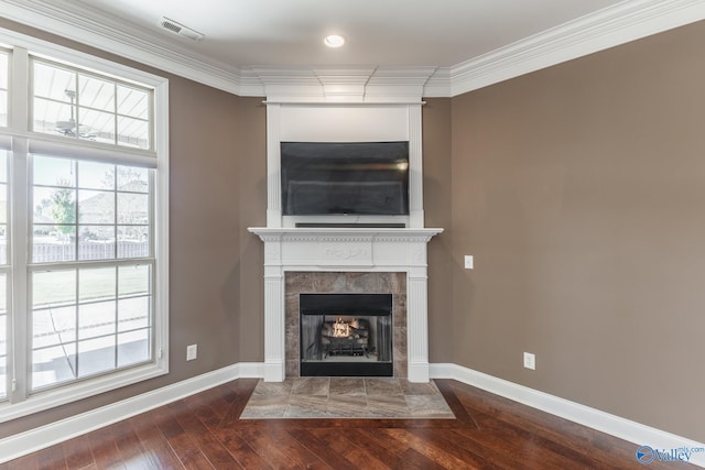 unfurnished living room featuring crown molding, a fireplace, and hardwood / wood-style floors