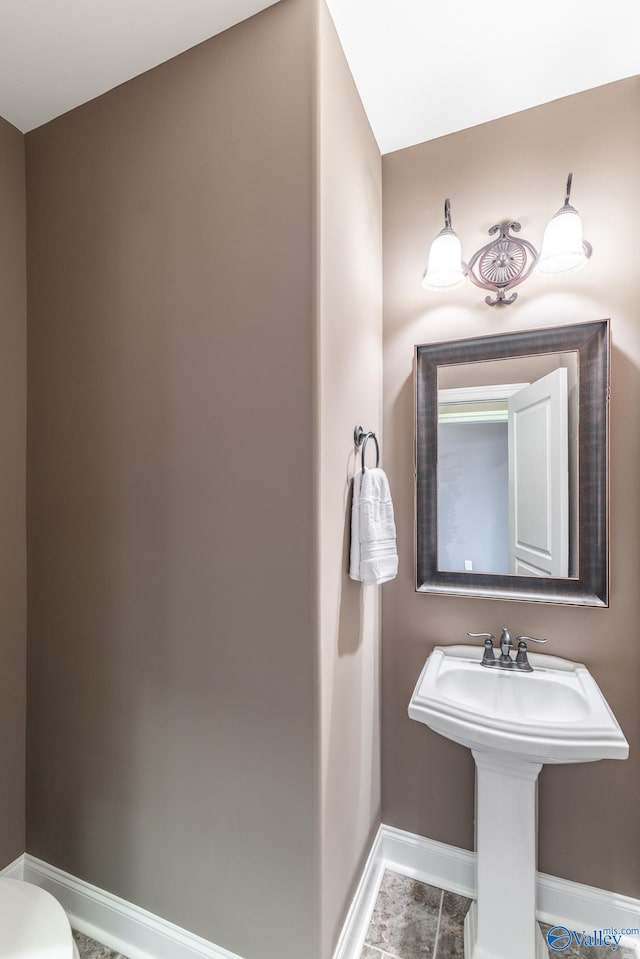 bathroom featuring toilet and sink