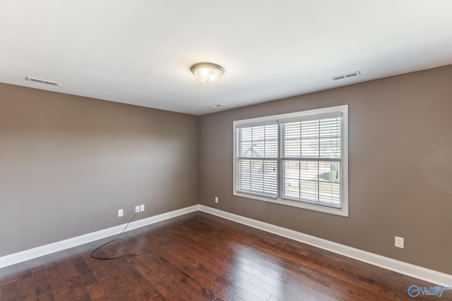 empty room featuring dark hardwood / wood-style floors