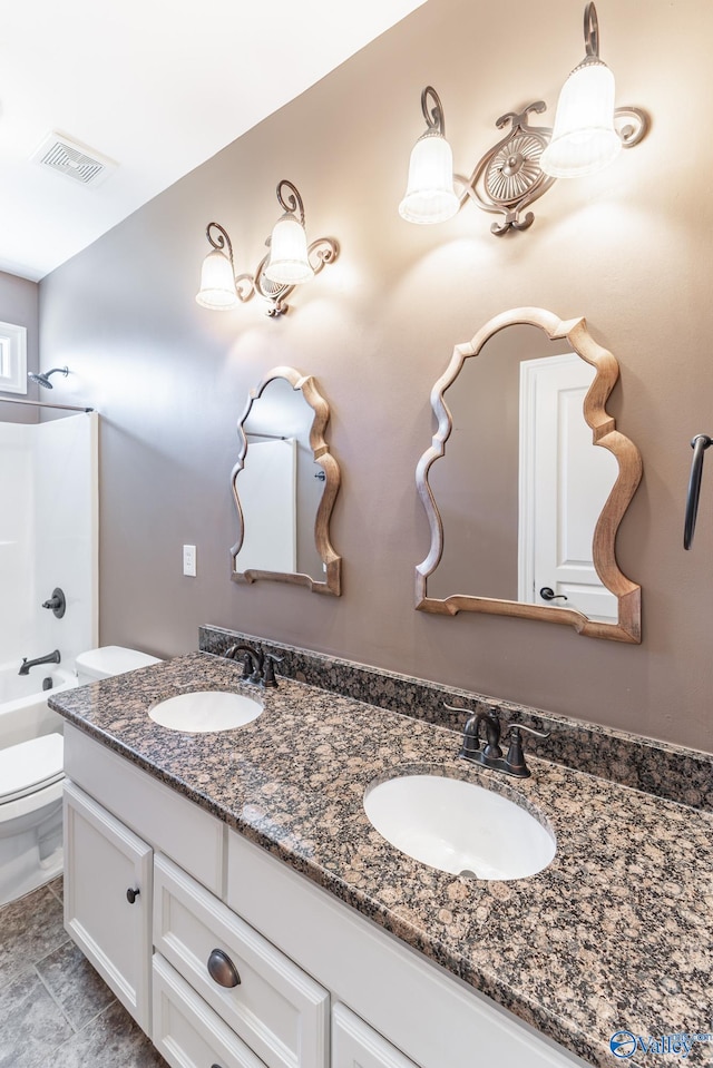 full bathroom with toilet, vanity, and tub / shower combination