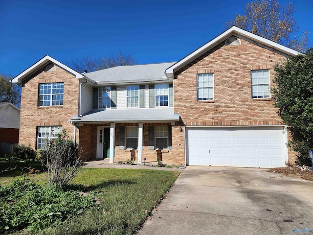 front facade with a porch, a garage, and a front yard