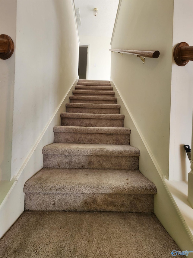 stairway with carpet flooring