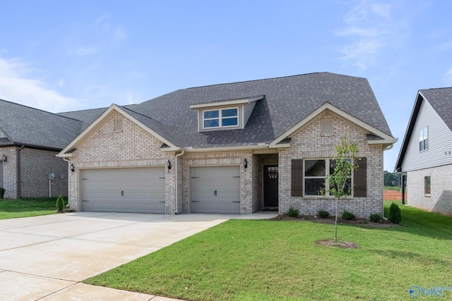 view of front of home featuring a front lawn and a garage