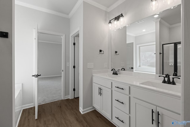 bathroom with shower with separate bathtub, vanity, hardwood / wood-style floors, and crown molding