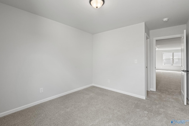 empty room featuring light colored carpet