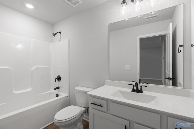 full bathroom featuring shower / bathing tub combination, vanity, and toilet