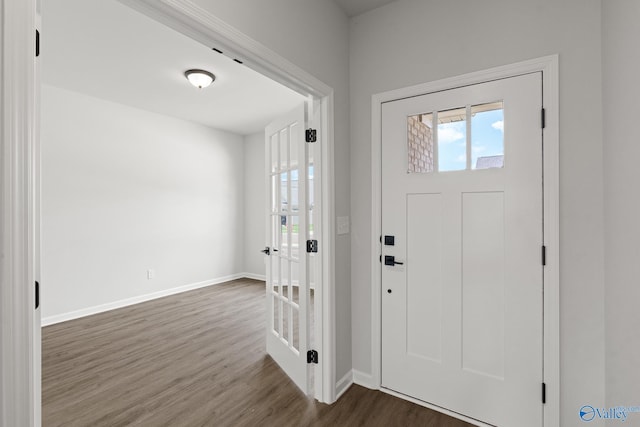 foyer entrance with dark hardwood / wood-style floors