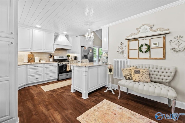 kitchen featuring custom exhaust hood, dark wood-style floors, visible vents, and stainless steel appliances
