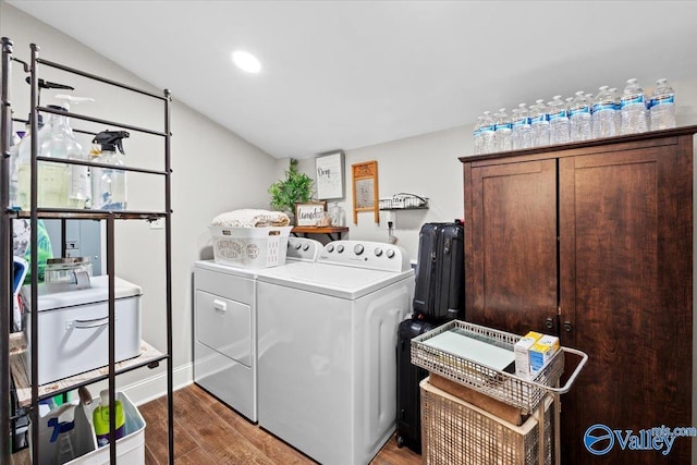 laundry area with washer and clothes dryer, recessed lighting, light wood-type flooring, and laundry area